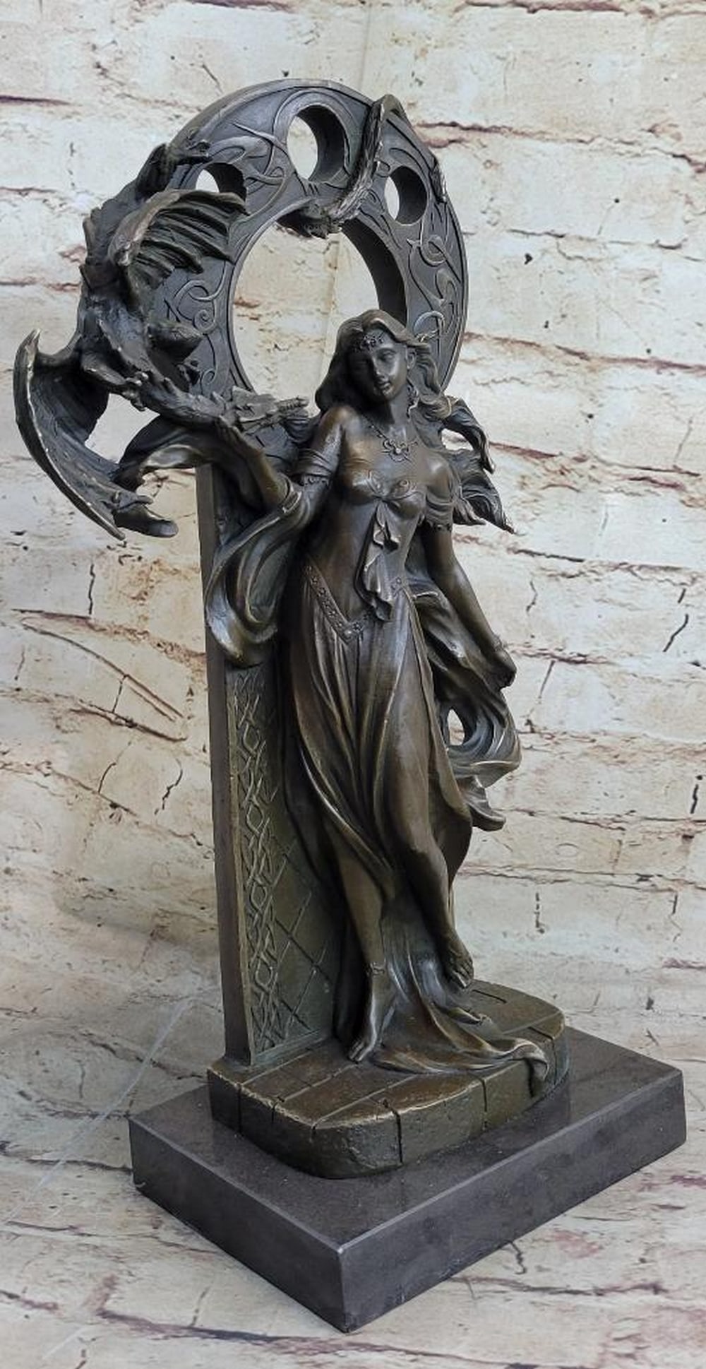 Bronze Dragon Guardian Sculpture by Jean Patoue - 16" x 8": Bronze Dragon Guardian Sculpture by Jean Patoue - 16" x 8" The Bronze Dragon Guardian Sculpture captures the powerful balance of strength and beauty in stunning detail. An alluring woman stand