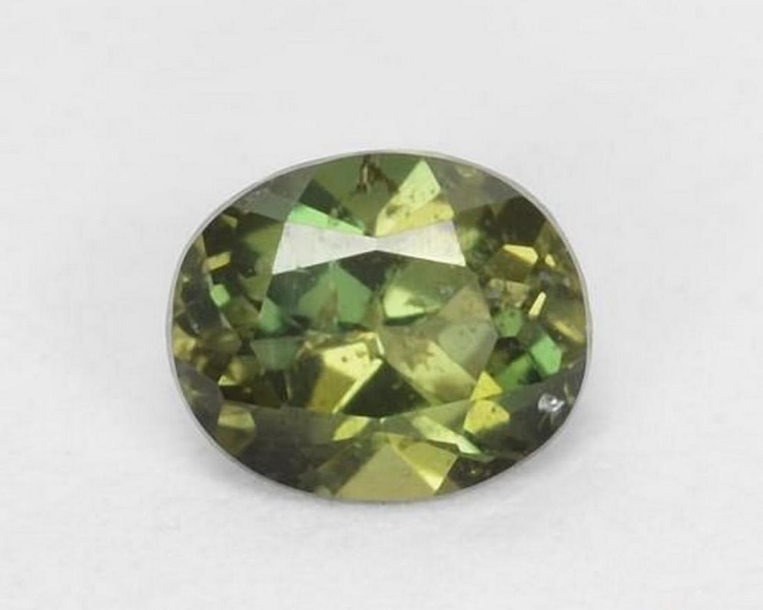 0.43 ct Natural Yellowish Green Kornerupine, Oval Cut, VS–SI (1 of 2)
