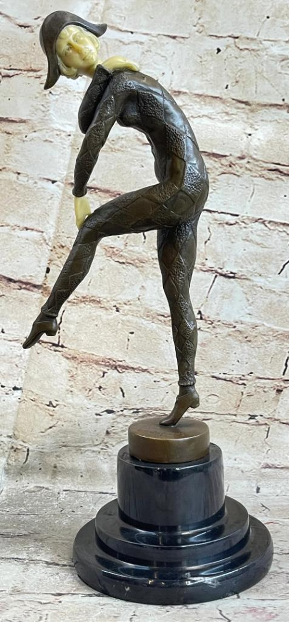 Interpretive Female Dancer Inspired Bronze Statue - 13.5" x 6.5: Interpretive Female Dancer Inspired Bronze Statue - 13.5" x 6.5 This elegant sculpture captures the grace of a woman dancing on stage, adorned in a fitted, diamond-patterned bodysuit with intricat