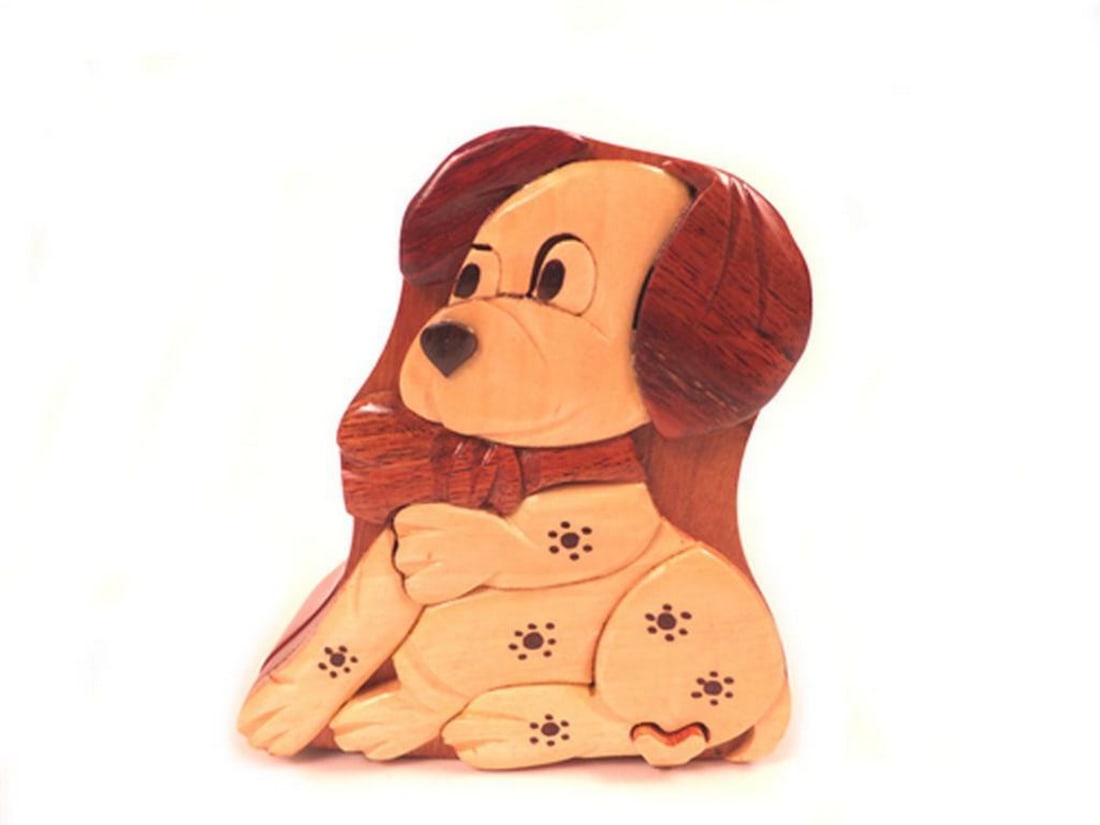 Dog Puzzle Keepsake Box: Dog Puzzle Keepsake Box This keepsake box features a dog-themed design and is crafted from mahogany wood. The piece includes a red velvet-lined interior, suitable for storing small items such as jewel