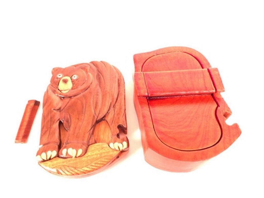 Bear Mahogany Puzzle Keepsake Box: Bear Mahogany Puzzle Keepsake Box This keepsake box features a bear design and is crafted from mahogany wood. The piece includes a red velvet-lined interior, suitable for storing small items such as