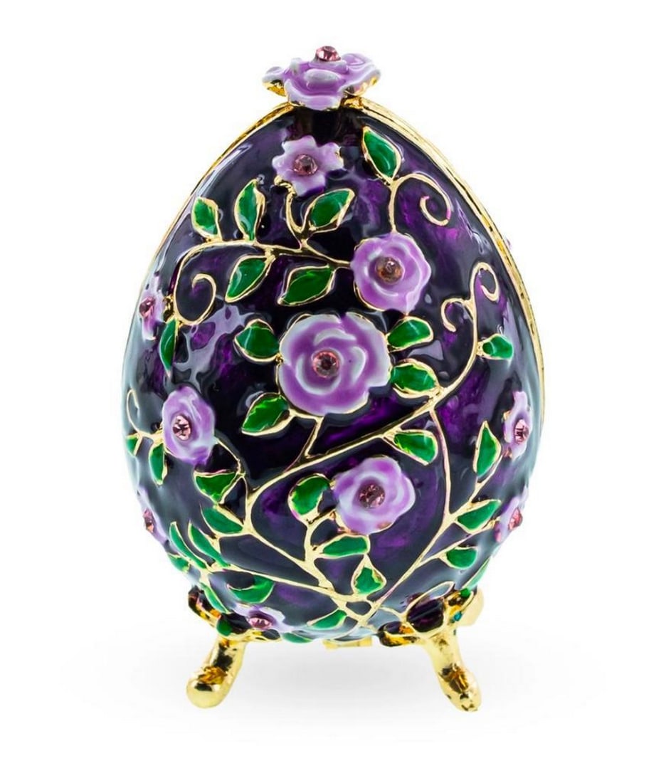 Purple Flowers on Purple Faberge Inspired Egg: Purple Flowers on Purple Faberge Inspired Egg This sparkling egg is adorned with clear crystals and high-polished enamel with golden trim. It opens on a hinge and has a magnetic closure to keep the