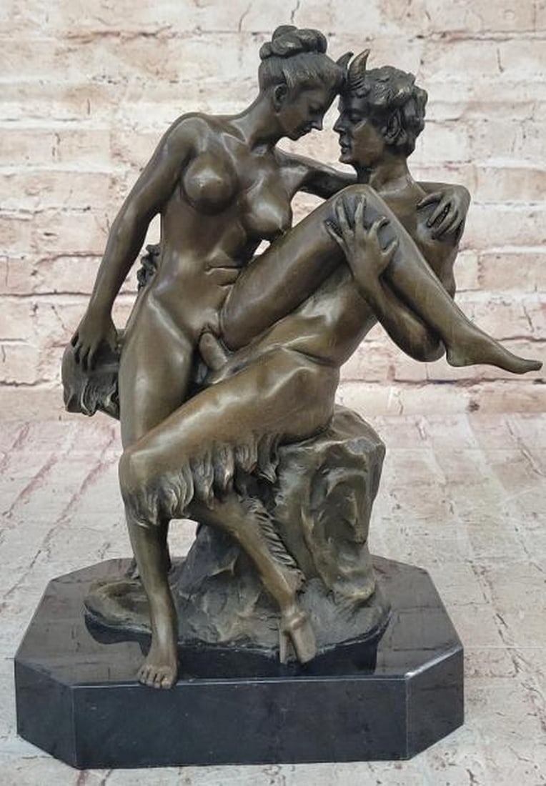 Mythic Union Erotic Bronze Sculpture: Mythic Union Erotic Bronze Sculpture A bold and mythologically charged reproduction bronze sculpture capturing an intimate moment between a satyr and a nude nymph. Rendered with dynamic detail and sen