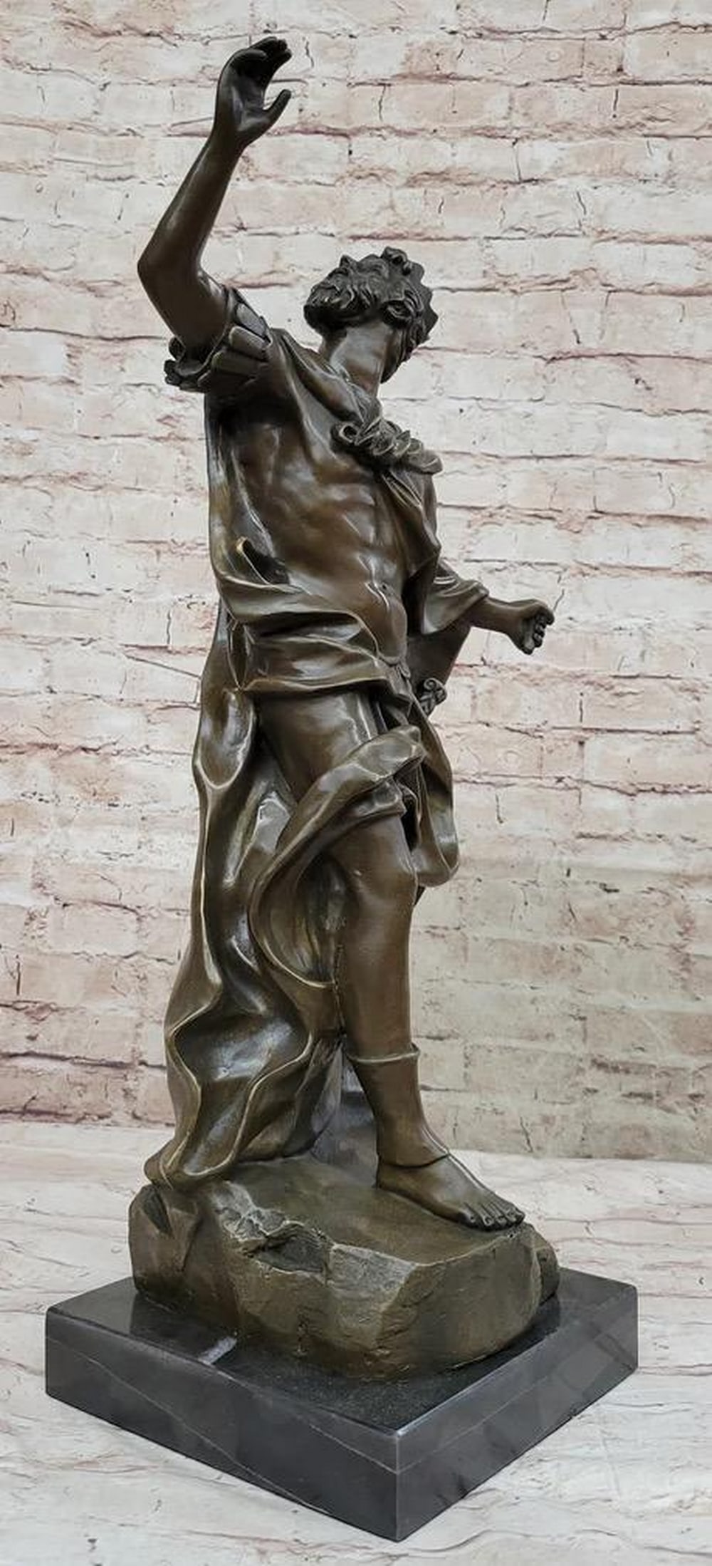 Royalties Call to the Gods Inspired Bronze Statue - 23" x 13": Royalties Call to the Gods Inspired Bronze Statue - 23" x 13" Witness the majestic figure of a man, embodying the regality of ancient times with outstretched arms beckoning to the celestial re