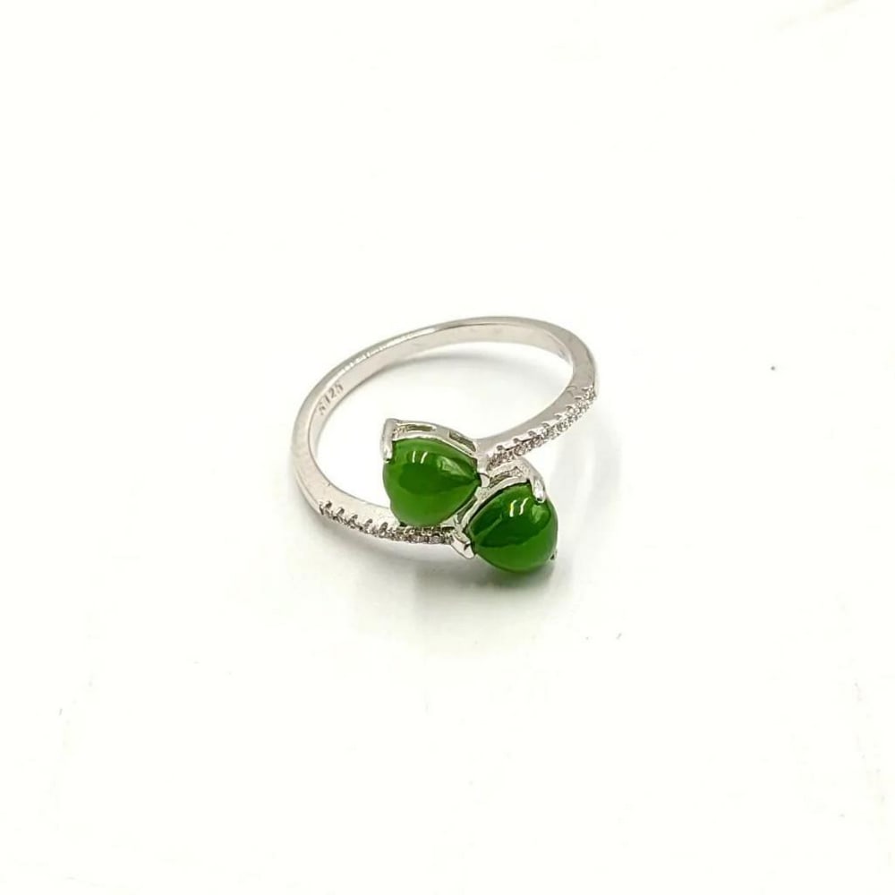 Canadian Nephrite Jade Double Heart & Austrian Crystal Studded 925 Sterling Silver Ring: Canadian Nephrite Jade Double Heart & Austrian Crystal Studded 925 Sterling Silver Ring Two heart shaped jade cabochons set on the ends of a sterling silver ring, lined with cubic zirconia
