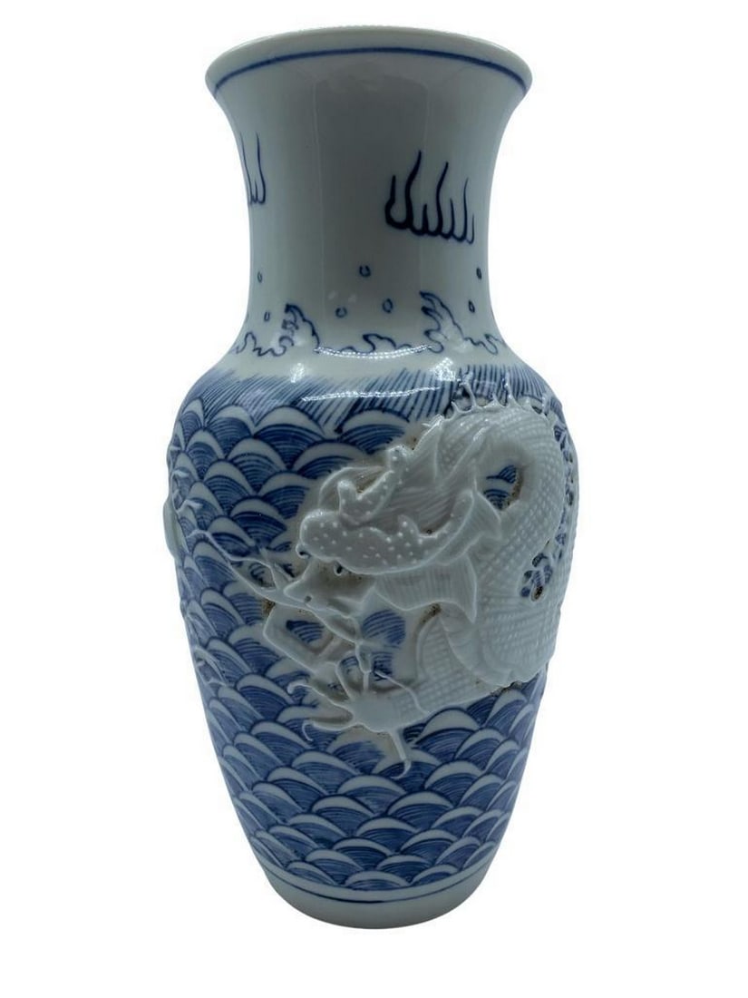 Stunning White & Blue Porcelain Dragon Vase: Stunning White & Blue Porcelain Dragon Vase The history of Chinese blue and white porcelain dates back to the Tang and Song eras, but it would take another hundred years, during the Yuan era, for