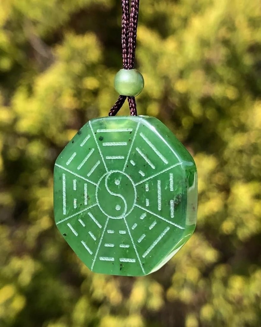 Canadian Nephrite Jade Yin Yang Pendant on Adjustable Rope Necklace: Canadian Nephrite Jade Yin Yang Pendant on Adjustable Rope Necklace Beautiful Yin Yang pendant that is hand carved from Canadian Nephrite Jade. This pendant measures approximately 25mm and comes on a 