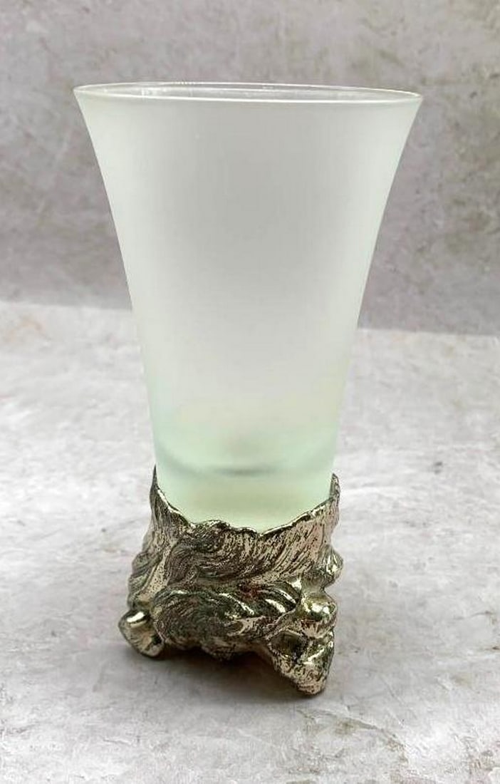 Frosted Glass with Metal Bear Head Base: Frosted Glass with Metal Bear Head Base Elevate your drinkware collection with this unique frosted glass, featuring a striking metal base adorned with the sculpted head of a bear. The textured frosted