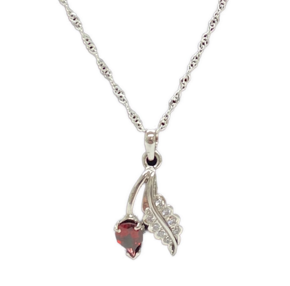 Lovely Leafling Garnet and Austrian Crystal 92.5 Purity Sterling Silver Pendant and Chain: Lovely Leafling Garnet and Austrian Crystal 92.5 Purity Sterling Silver Pendant and Chain A beautiful pear shaped Garnet accompanied by a stunning Austrian Crystal filled Leaf set in 92.5 purity