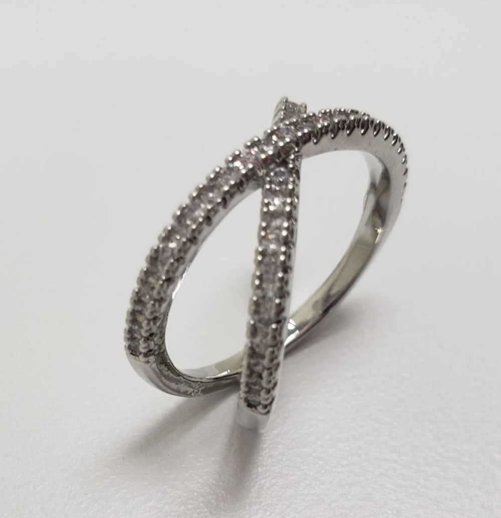 Sterling Silver 925 CZ Rhinestone Crossband Ring: Sterling Silver 925 CZ Rhinestone Crossband Ring. Ladies Size 7. Please View Photos For Further Details.