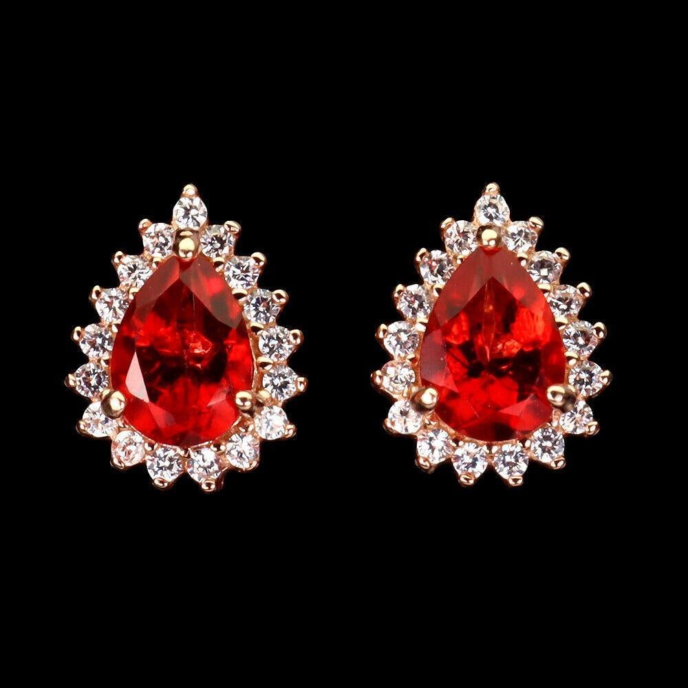 Pear Cut Red Topaz (7x5mm) Rose GP Earrings With White Topaz Crown Mount: Pear Cut Red Topaz (7x5mm) Rose GP Earrings With White Topaz Crown Mount PRODUCT TYPEEARRINGS TYPE OF METAL925 STERLING SILVER PLATE14K ROSE GOLD MAIN STONE: RED TOPAZ OTHER GEMS: WHITE TOPAZ TOTAL