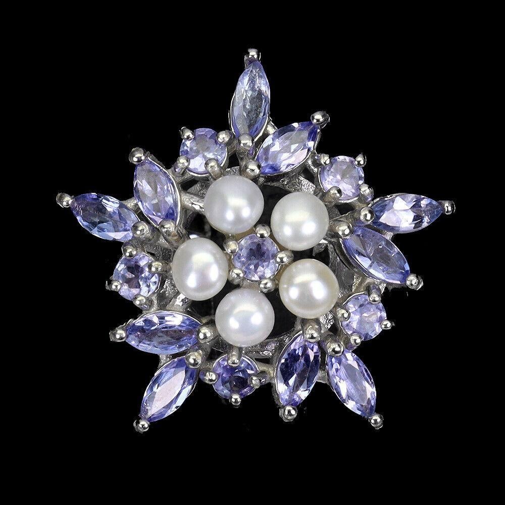 Marquise Cut Tanzanite 5x2.5mm Sterling Silver Ring With 4 Pearl & Round Cut Center Stone - Size 7.5: Marquise Cut Tanzanite 5x2.5mm Sterling Silver Ring With 4 Pearl & Round Cut Center Stone - Size 7.5 TYPE OF METAL: 925 STERLING SILVER PLATE: 14K WHITE GOLD RING SIZE: 7.5 MAIN STONE: TANZANITE O