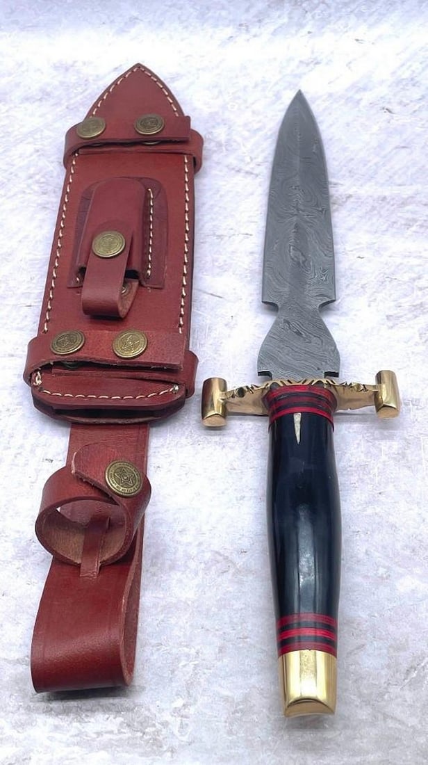 15 1/2" Brass & Wooden Handled Damascus Shive Sword: 15 1/2" Brass & Wooden Handled Damascus Shive Sword With Stitched Leather Sheath An Excellent Hand Crafted Shive To Add To Any Collection. High Quality steel is utilized to forge the finest pr