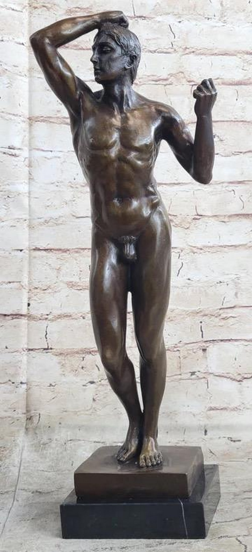 Posing Nude Man Inspired Bronze Statue - 18" x 8": Posing Nude Man Inspired Bronze Statue - 18" x 8" This captivating bronze sculpture depicts a tranquil nude man in a serene moment, bathed in morning sunlight from an open window. Reflecting d