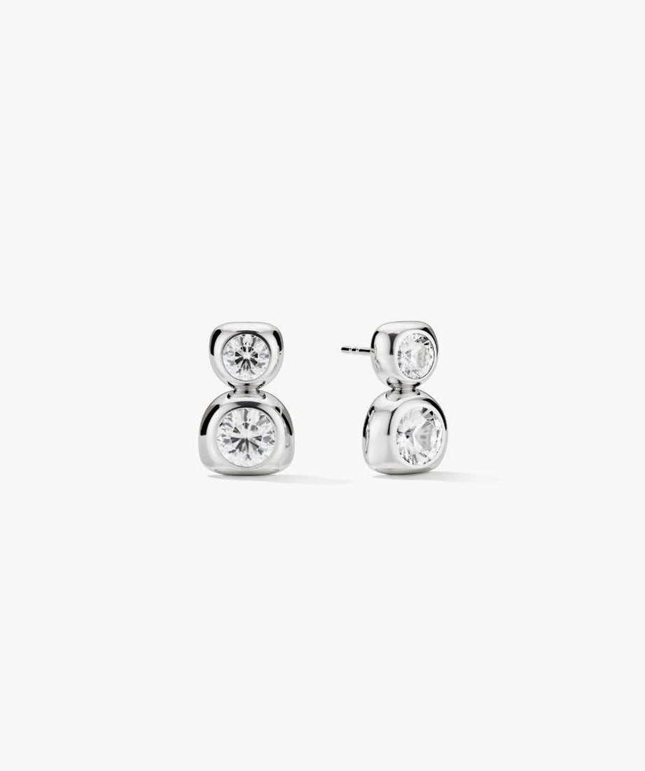 Sterling Silver Lab-Grown Sapphire Drop Earrings: Sterling Silver Lab-Grown Sapphire Drop Earrings A pair of drop earrings featuring lab-grown sapphires in a double-stone design. The sapphires are produced through an eco-friendly growth process, offe