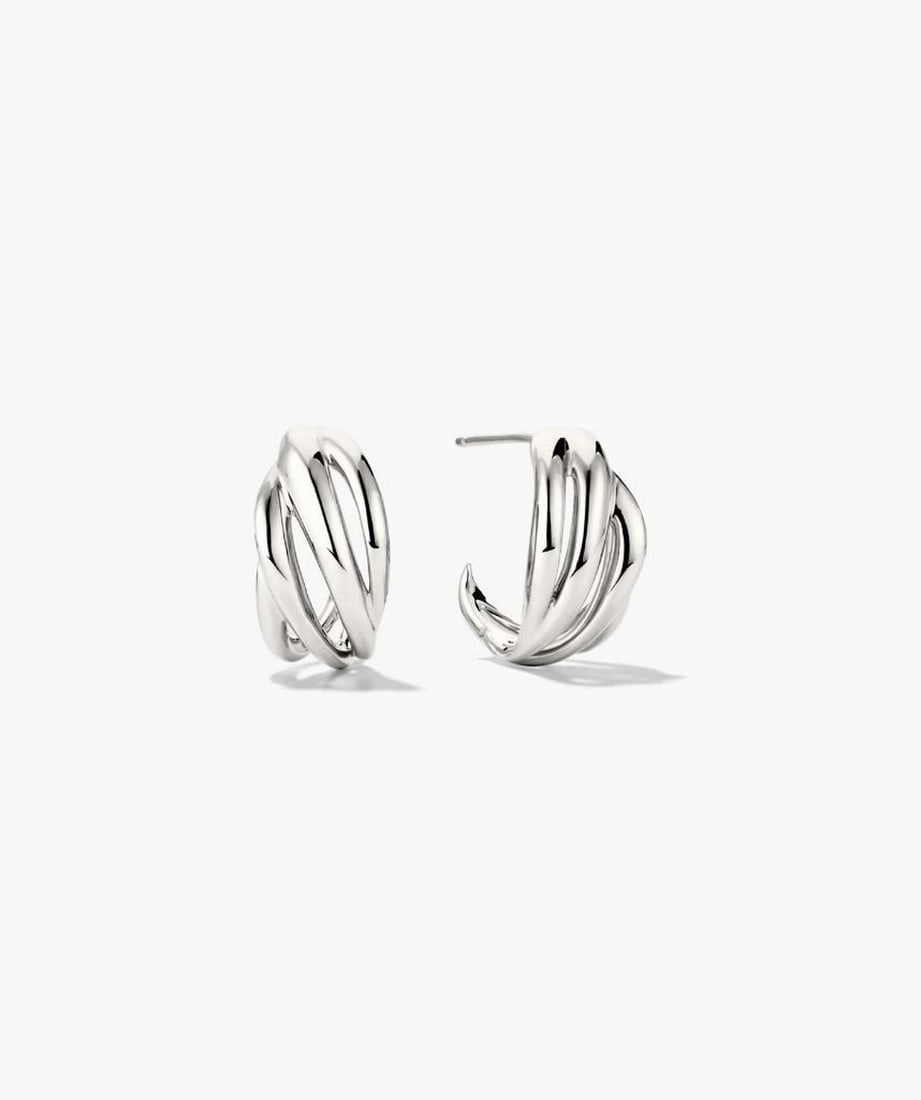Textured Sterling Silver Asymmetrical Hoops: Textured Sterling Silver Asymmetrical Hoops Minimalism with a twist. These textured sterling silver hoops feature open spaces and an asymmetrical design, offering a fresh, modern take on everyday eleg