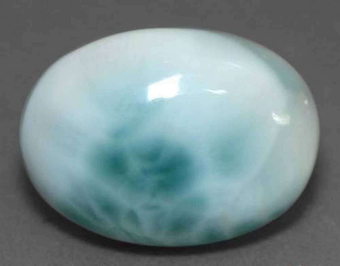 10.24 ct Natural Light Blue Larimar, Oval Cabochon, Translucent, Dominican Republic: 10.24 ct Natural Light Blue Larimar, Oval Cabochon, Translucent, Dominican Republic Natural larimar weighing 10.24 carats, cut in an oval cabochon with light blue color. The gem measures 17.97 x