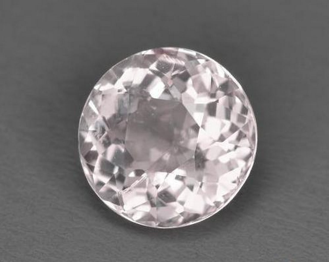 1.52ct Natural Light Pink Morganite, Round, VS: 1.52ct Natural Light Pink Morganite, Round, VS A natural morganite weighing 1.52 carats, cut into a perfectly calibrated 7.5 mm round facet. This gem displays a delicate light pink color with VS clari