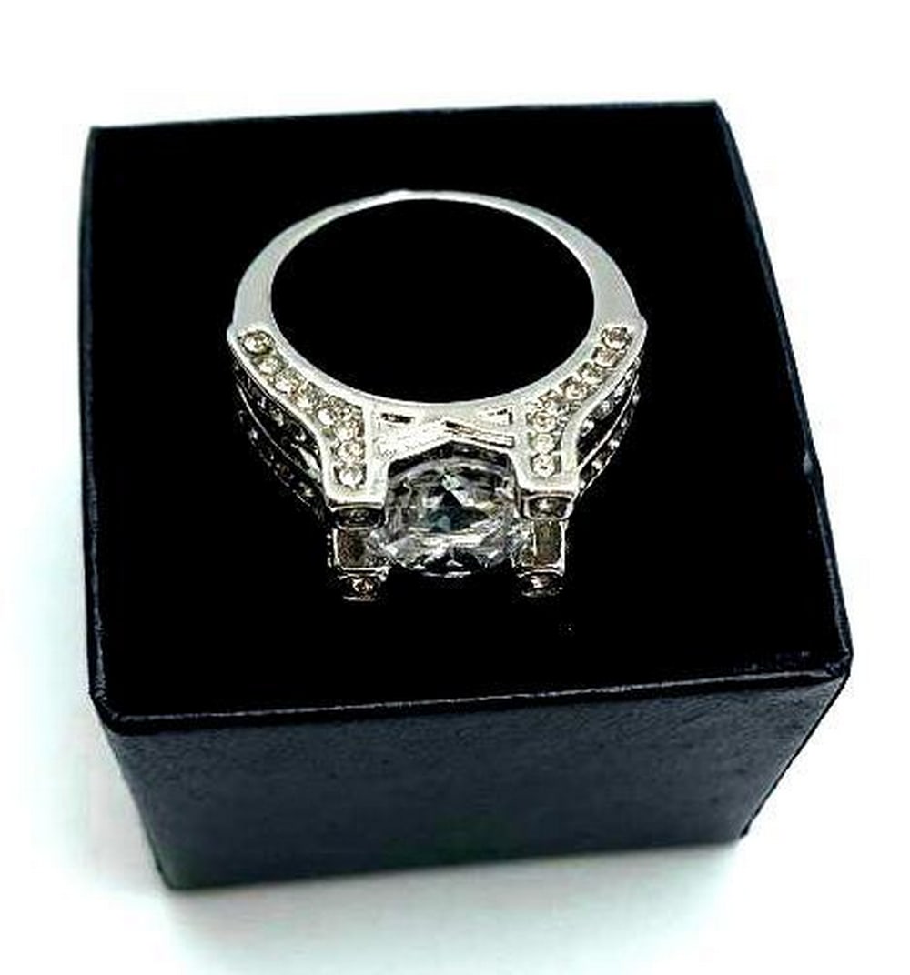 Ladies 925 Silver Marked 2 Carat Main Stone CZ Diamond Ring: A Simple And Beautiful 925 Silver Ring Faceted With A 2 Carat CZ Diamond. Simply Stylish And Beautiful, You Will Never Get Tired Of Wearing This Glamorous Ring. View Photos for Further Details.