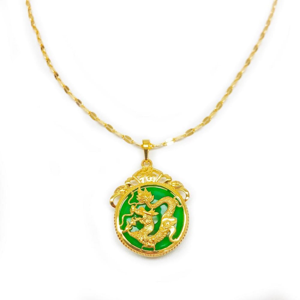 Chinese Carved Green Jade In Gold Dragon Mount Necklace: Chinese Carved Green Jade In Gold Tone Dragon Mount Pendant. The Pendant Is Accompanied With Necklace Shown In The Photos.