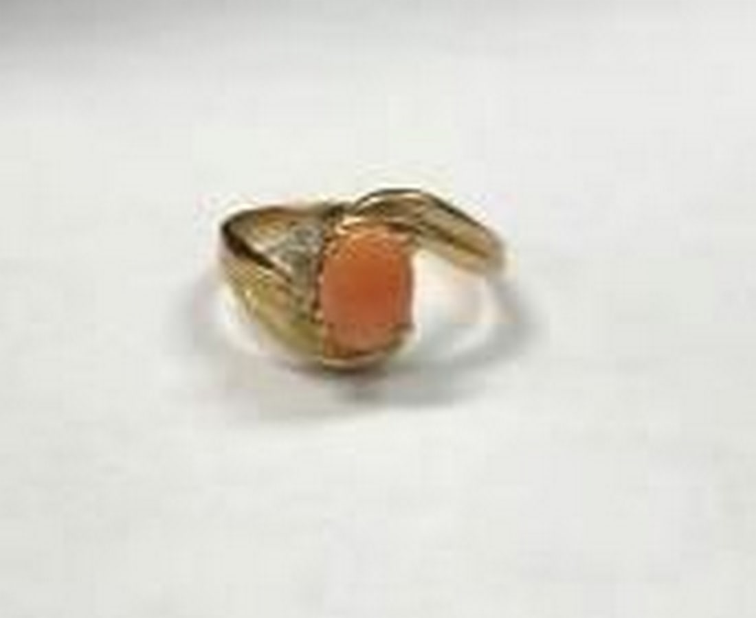 Gold-Plated Coral Oval Ring with White Accent Stones: Gold-Plated Coral Oval Ring with White Accent Stones Add a touch of warm, vintage-inspired charm to your look with this beautiful gold electroplated ring, featuring a smooth coral oval stone at its