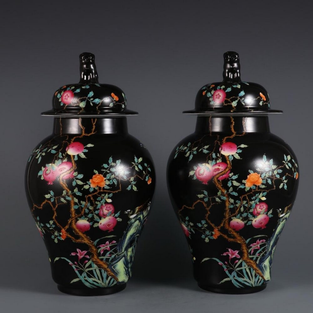 Elegant Pair of Black Glaze Enamel Flower and Fruit Jars: Elegant Pair of Black Glaze Enamel Flower and Fruit Jars This elegant pair of jars features a rich black glaze ground, beautifully complemented by vibrant enamel designs of flowers and fruits. The int