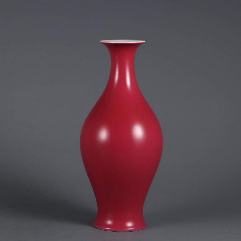 Carmine Glazed Olive Bottle: Carmine Glazed Olive Bottle. This elegant carmine glazed olive bottle showcases the vibrant, deep red hue that defines high-quality porcelain artistry. The rich carmine glaze, with its glossy finish, 