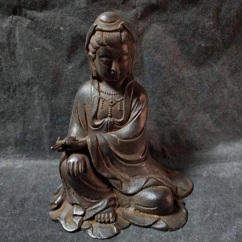 Antique Ironware South Sea Guanyin Statue: Antique Ironware South Sea Guanyin Statue This antique ironware statue features South Sea Guanyin, the bodhisattva of compassion, depicted in a serene and graceful pose. Crafted from durable