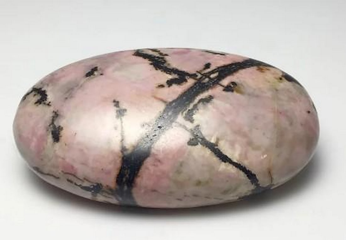 Heartfelt Harmony Rhodonite Gratitude Stone: Heartfelt Harmony Rhodonite Gratitude Stone The Heartfelt Harmony Rhodonite Gratitude Stone radiates a beautiful blend of pink and black hues, symbolizing emotional healing and balance. Known for its
