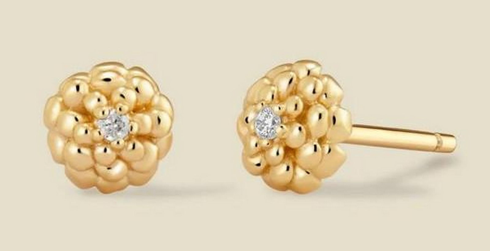 Gold Vermeil Cubic Zirconia Stud Earrings: Gold Vermeil Cubic Zirconia Stud Earrings A timeless stud design featuring prong-set cubic zirconia stones for a sparkling, elegant look. Perfectly sized for everyday wear or layering with other