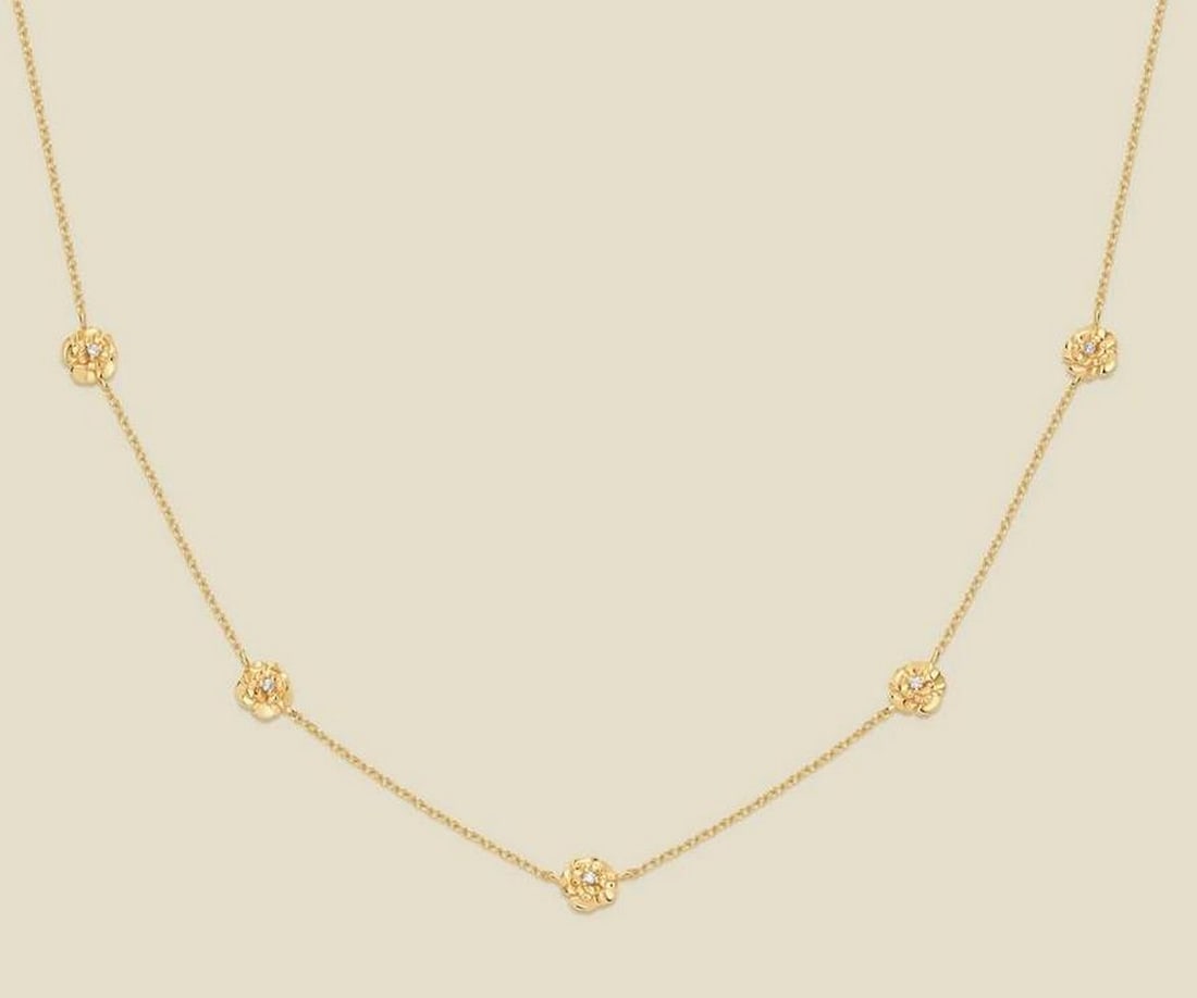 Gold Vermeil January Carnation CZ Necklace: Gold Vermeil January Carnation CZ Necklace This delicate necklace features lifelike January carnation silhouettes accented with prong-set cubic zirconia for subtle sparkle. Crafted in gold vermeil,