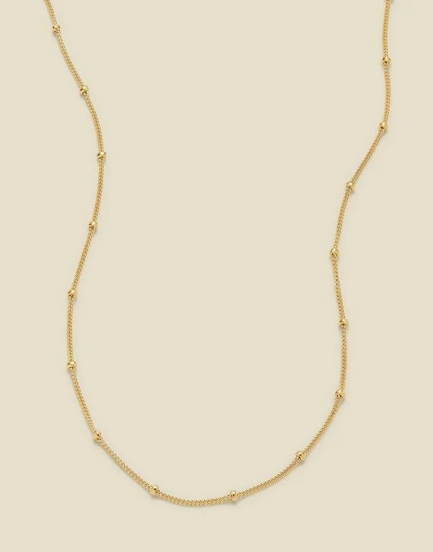 Starlit Satellite Chain: Starlit Satellite Chain Delicate and luminous, this timeless chain adds a subtle shimmer to every moment. Lightweight yet eye-catching, its evenly spaced accents create a celestial glow, perfect for