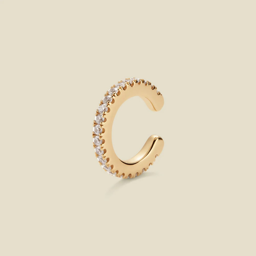 Vermeil Gold & CZ Luxe Ear Cuff Earrings: Vermeil Gold & CZ Luxe Ear Cuff Earrings Elevate your everyday with a touch of luxury. This shimmering ear cuff, adorned with a delicate row of inlaid CZs, effortlessly slides onto your earlobe, a