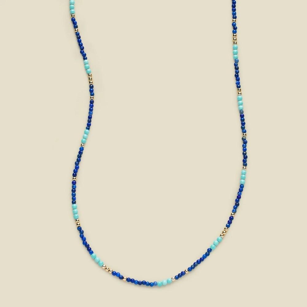 Azure Harmony Turquoise & Lapis Beaded Necklace – Gold Vermeil: Azure Harmony Turquoise & Lapis Beaded Necklace – Gold Vermeil A choker-style necklace featuring 2mm beads of turquoise and lapis, known for their natural variation and unique color patterns.