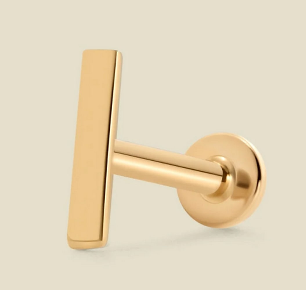 14k Solid Gold Bar Stud Earring: 14k Solid Gold Bar Stud Earring With a flawlessly polished finish, these bar earrings add a subtle pop of shine. Each petite, solid gold earring features a smooth, flat back that slides through your