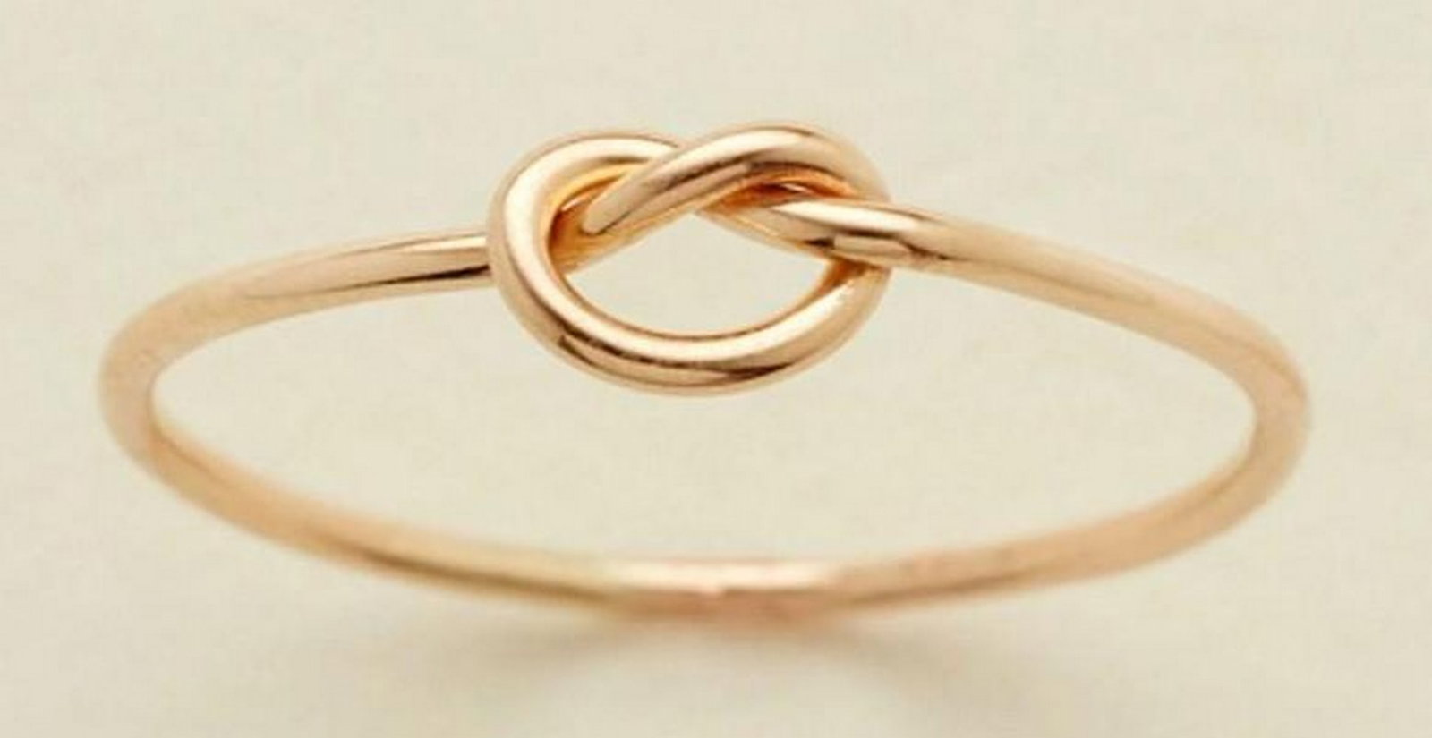 Endless Knot Ring - Size 7: Endless Knot Ring - Size 7 A delicate symbol of connection and commitment, the Endless Knot Ring is a timeless tribute to the bonds that shape us. Handcrafted with care, its subtle knot design serves