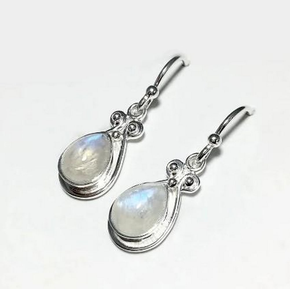 Rainbow Moonstone Drop Earrings: Rainbow Moonstone Drop Earrings These Rainbow Moonstone Drop Earrings feature the ethereal glow of moonstone, with flashes of iridescent blue and white that shift with movement. Known for its