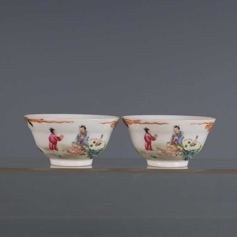 Pair Of Famille Rose Cups: Pair Of Famille Rose Cups. Delight in the elegance of Qing Dynasty porcelain with this exquisite pair of Famille Rose cups, inspired by the refined artistry of the Yongzheng period (1723–1735). Each