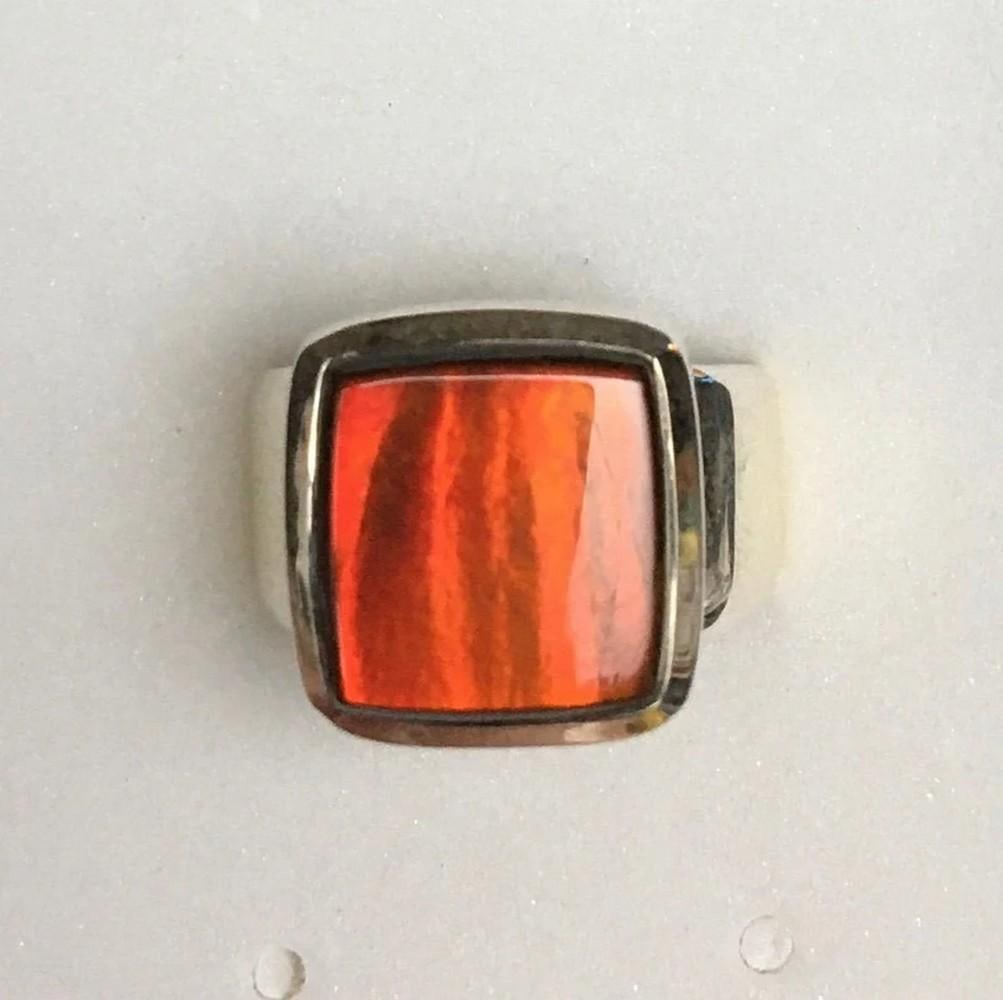 Elemental Light Ammolite Ring - Size 8: Elemental Light Ammolite Ring - Size 8 This stunning ring features a vibrant red ammolite gemstone, measuring 11mm x 11.5mm in a freeform shape. At extreme angles, the stone shifts to a beautiful