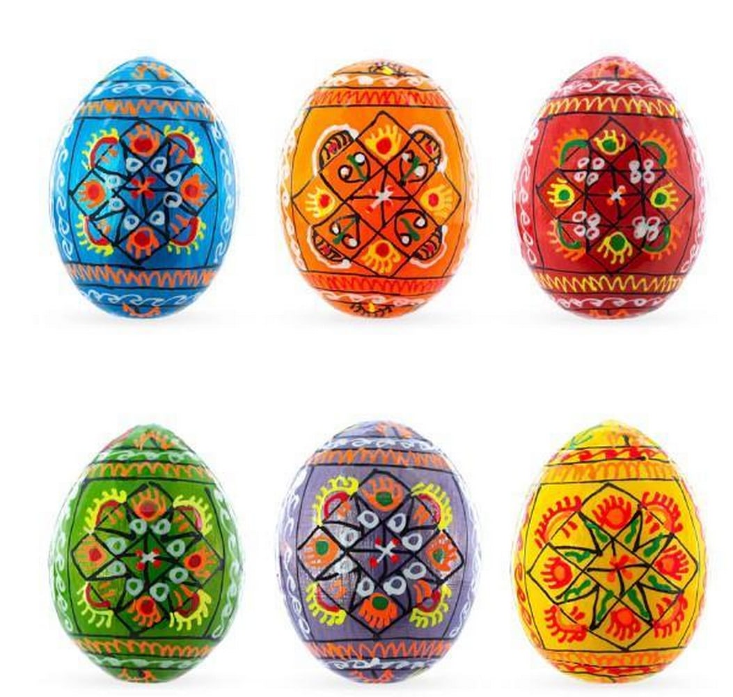 Echoes of Ukraine Egg Set: Echoes of Ukraine Egg Set This exquisite set of 6 hand-painted wooden eggs are adorned with vibrant and intricate designs. These eggs showcase a stunning array of colours-accented with symbolic