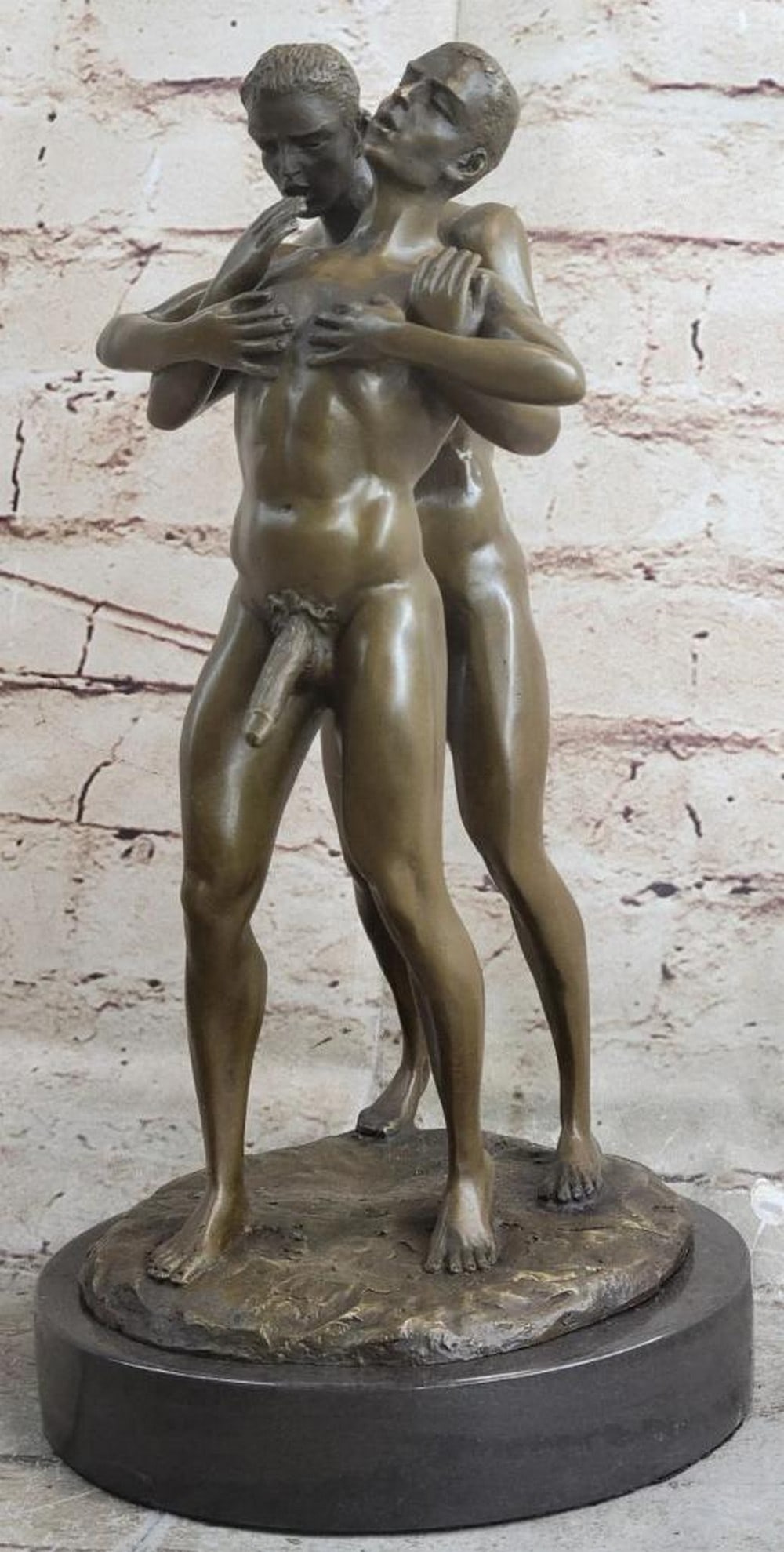 Carefree Embrace Original Bronze Sculpture - 12.5in. x 7.5in.: Carefree Embrace Original Bronze Sculpture - 12.5 x 7.5 This expressive bronze sculpture captures the joyful connection of two men in a flirtatious embrace. The intricate detailing highlights their em