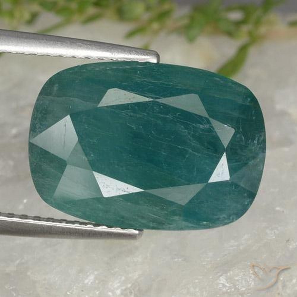 7.78ct Cushion Cut Dark Green Grandidierite: 7.78ct Cushion Cut Dark Green Grandidierite A rare, untreated dark blue-green grandidierite with a cushion cut, VS-SI clarity, and remarkable brilliance. Believed to enhance intuition, calm the mind, 