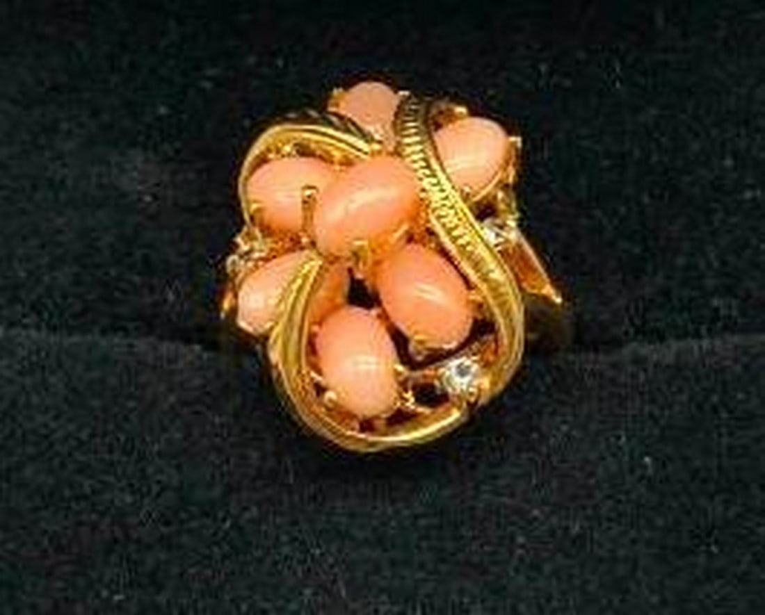 Gorgeous Coral Gemstone Ring on an 18KTGP Band: Gorgeous Coral Gemstone Ring on an 18KTGP Band Vibrant and full of charm, this stunning ring features a radiant coral gemstone that adds a warm pop of color and elegance. Set atop a gleaming 18KT