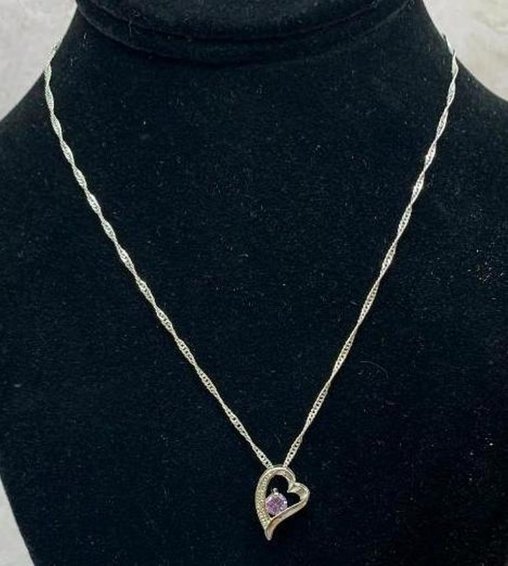 Sterling Silver Heart Necklace with Purple Stone: Sterling Silver Heart Necklace with Purple Stone Fall in love with timeless elegance. This sterling silver necklace features a beautifully crafted heart-shaped pendant, adorned with shimmering white c