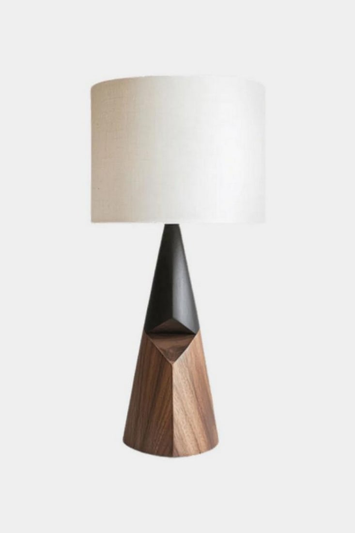 Black?and?Wood Geometric Table Lamp: Black?and?Wood Geometric Table Lamp This table lamp features a cylindrical white shade paired with a two?part base that contrasts smooth and faceted forms. The upper section is a matte black cone,