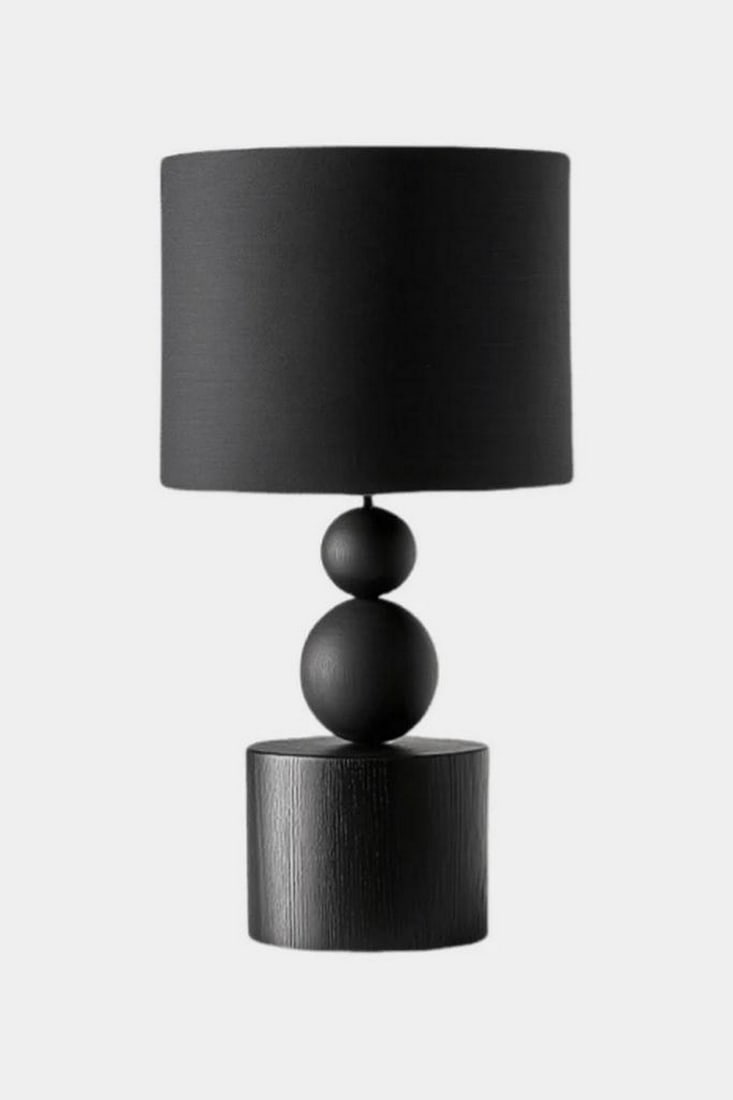 Contemporary Black Stacked Sphere Lamp: Contemporary Black Stacked Sphere Lamp Bold and sculptural, this modern table lamp features a cylindrical base topped with two stacked spheres, creating a silhouette that's both architectural and