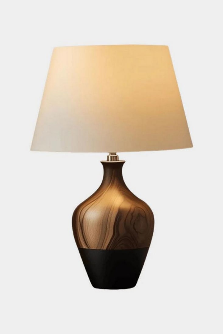 Handcrafted Wooden Art Lamp: Handcrafted Wooden Art Lamp Warm and refined, this handcrafted lamp features a wide, tapered beige shade that emits a soft ambient glow. The base showcases a smooth gradient finish-from deep brown to