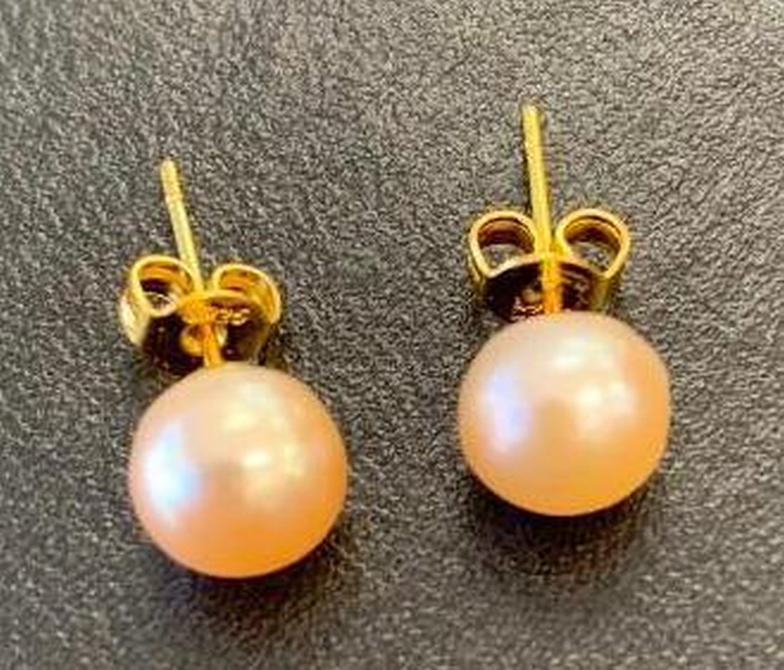 Sterling Silver Gold-Plated Pearl Stud Earrings: Sterling Silver Gold-Plated Pearl Stud Earrings Add a touch of classic sophistication to your jewelry collection with these gold-plated sterling silver pearl stud earrings. Each pair features lustrous