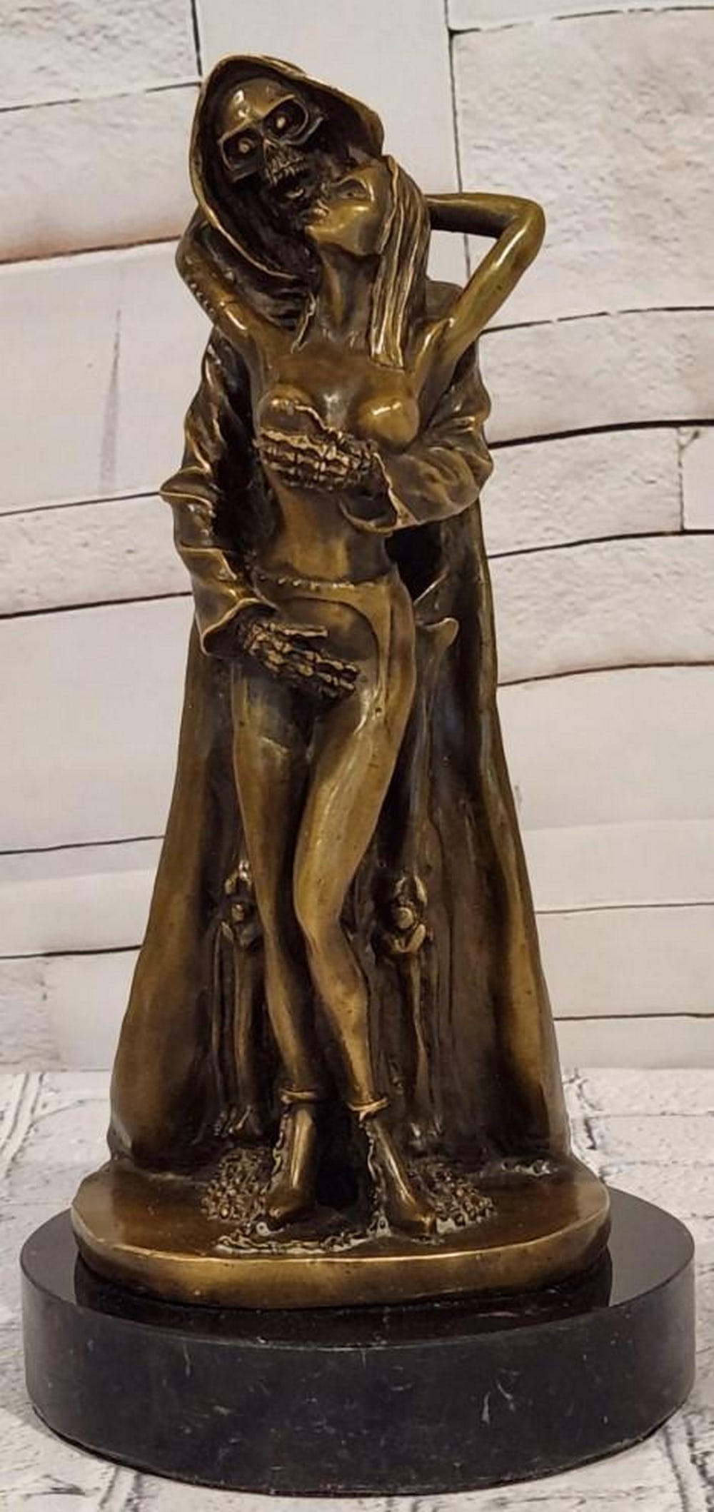 Grim Reaper Bronze Sculpture Death Embrace Female Figure: Up for auction. This bronze sculpture presents the powerful and symbolic composition of a woman embraced by the Angel of Death. This piece depicts themes of the balance between life and the inevitable