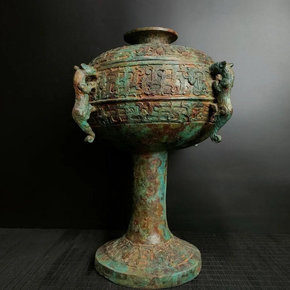 Antique Chinese Bronze Four-Dragon Round Bean Statue Ornament: Antique Chinese Bronze Four-Dragon Round Bean Statue Ornament This rare handcrafted bronze statue features a striking round bean shape, intricately adorned with four powerful dragon motifs.